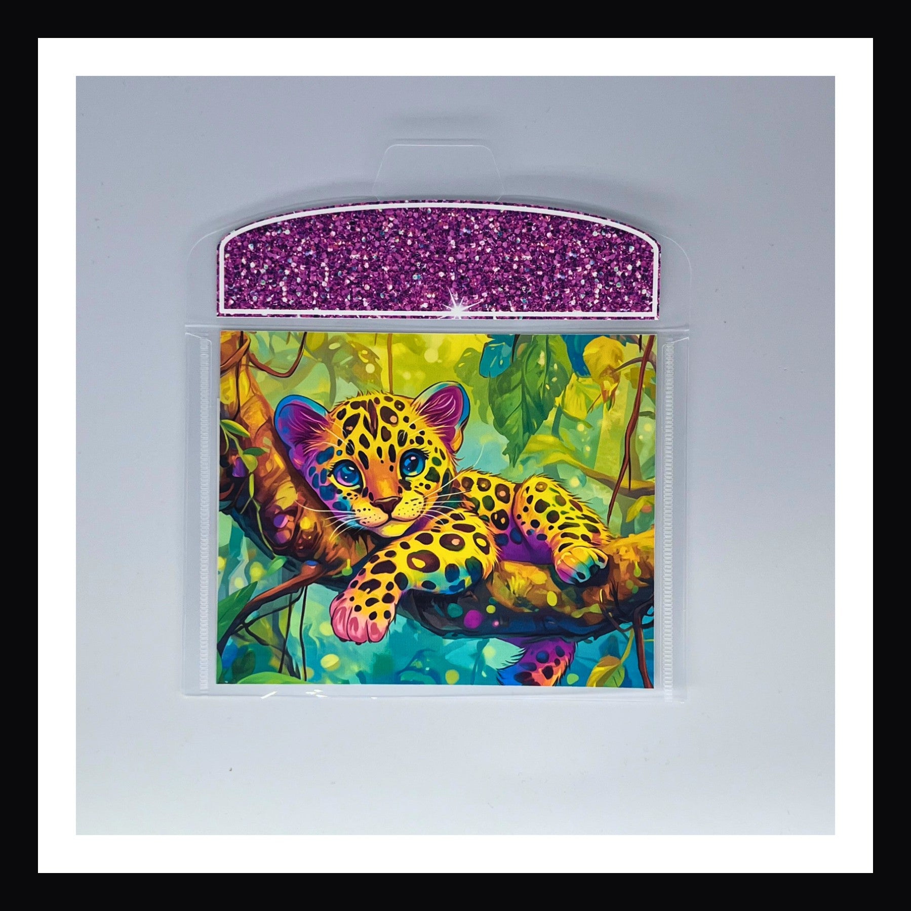 Bright 90s Style Envelope - Jaguar print features an adorable Jaguar kitten relaxing in a jungle setting.  Contrasting flap color is a vivid fuchsia.