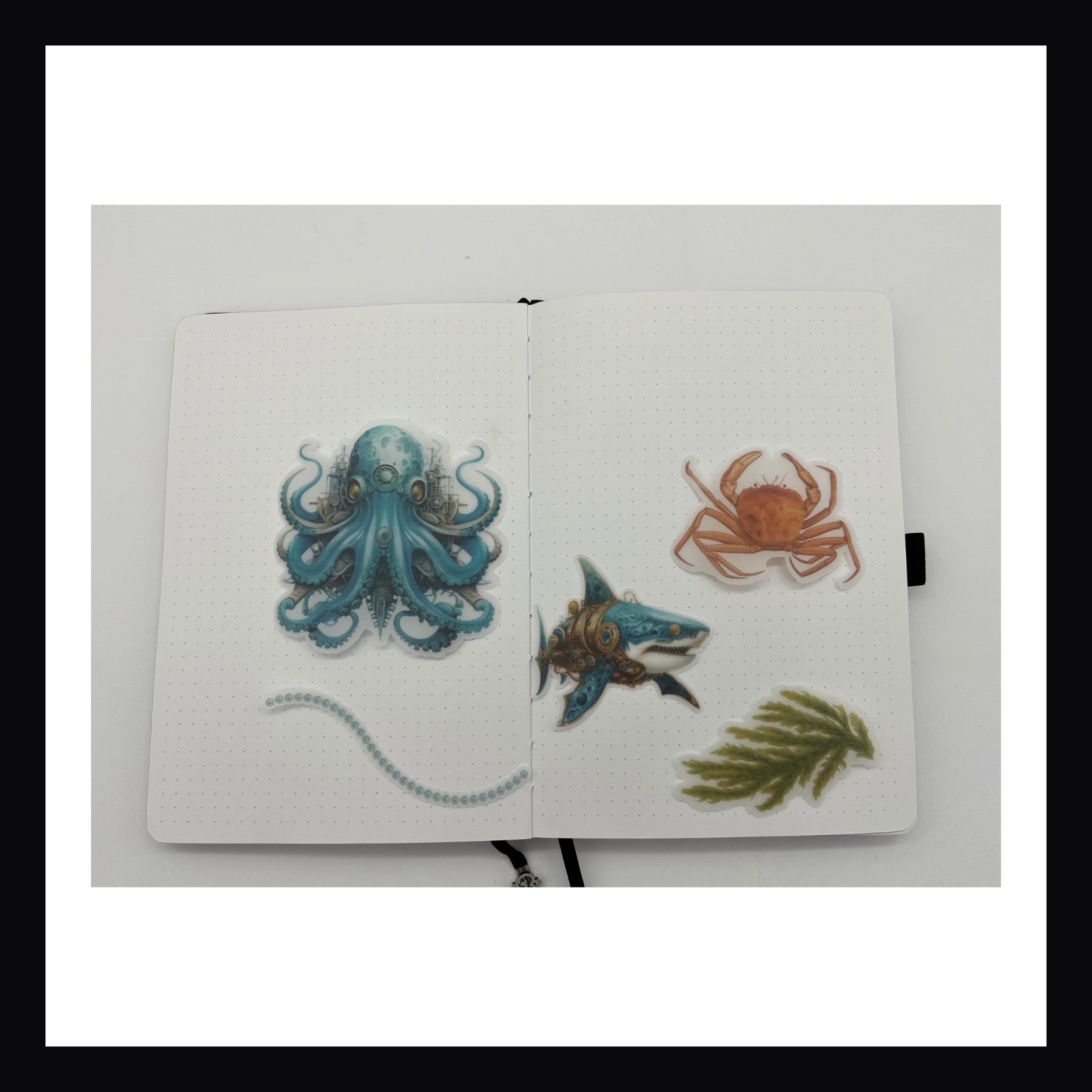 Steampunk Ocean Junk Journaling Kit features 5 vellum elements.  Each element features a different vibrant image matching the theme.  The elements are each fancy cut.