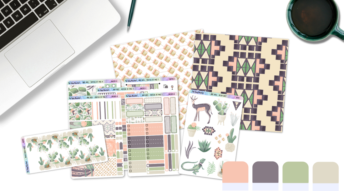 Planner stickers, patterned paper and color swatches on a desktop with a computer and cup of coffee.