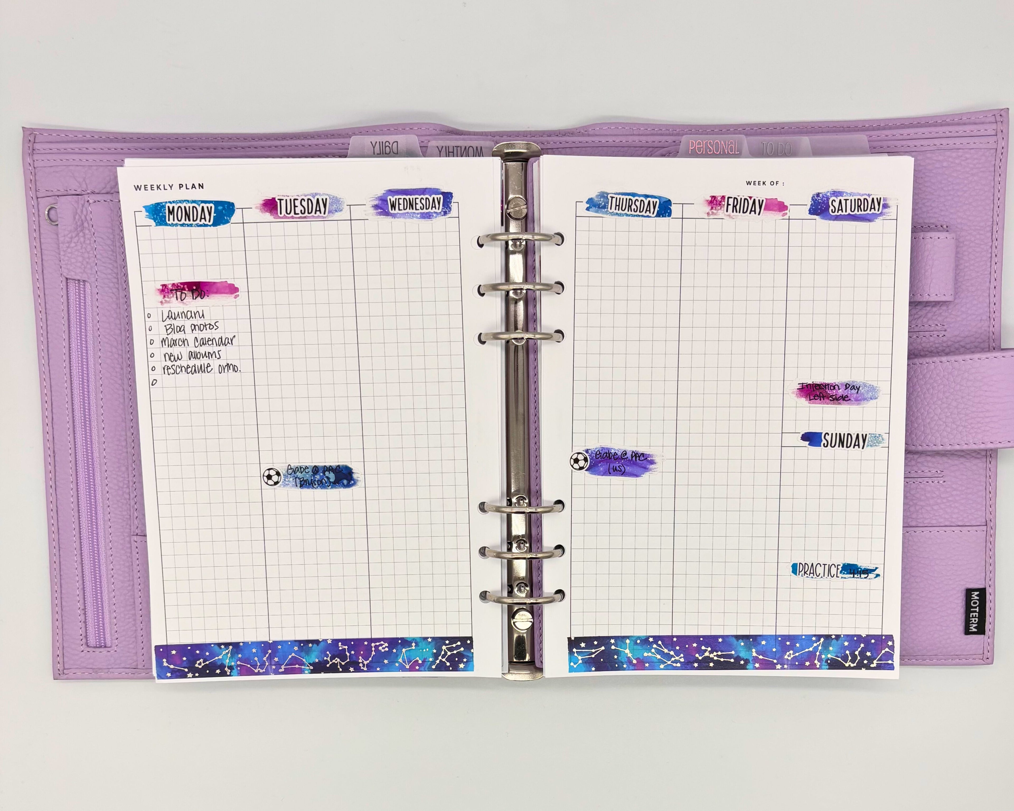 Weekly planner layout with brushstroke stickers used as date covers.