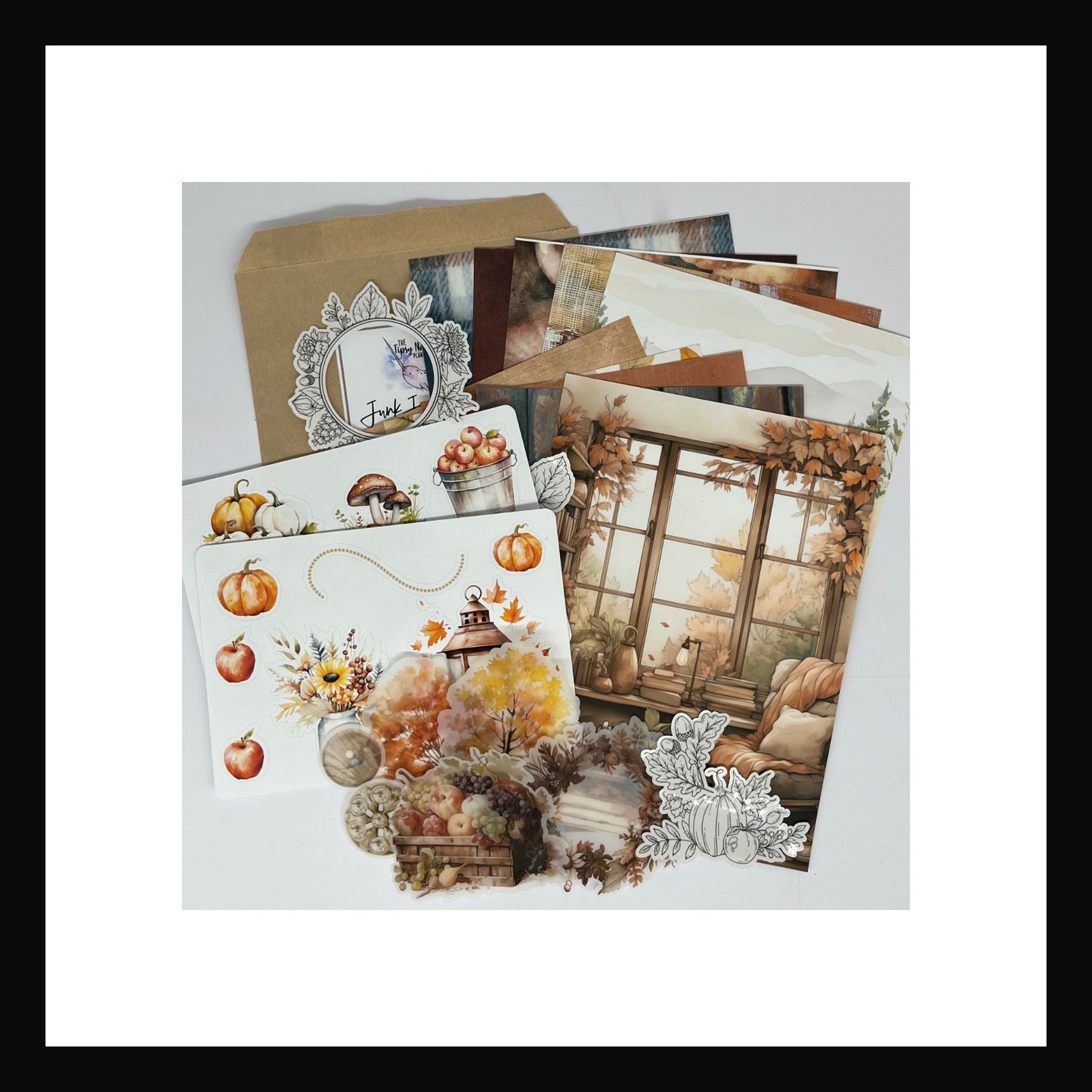 Autumn Days Junk Journaling Kit is a collection of 20 papers, two full color sticker sheets, vellum elements and clear glossy black and white stickers.  This kit is Autumn themed featuring right tones of red, orange, yellows and browns with accents of blue and green. 
