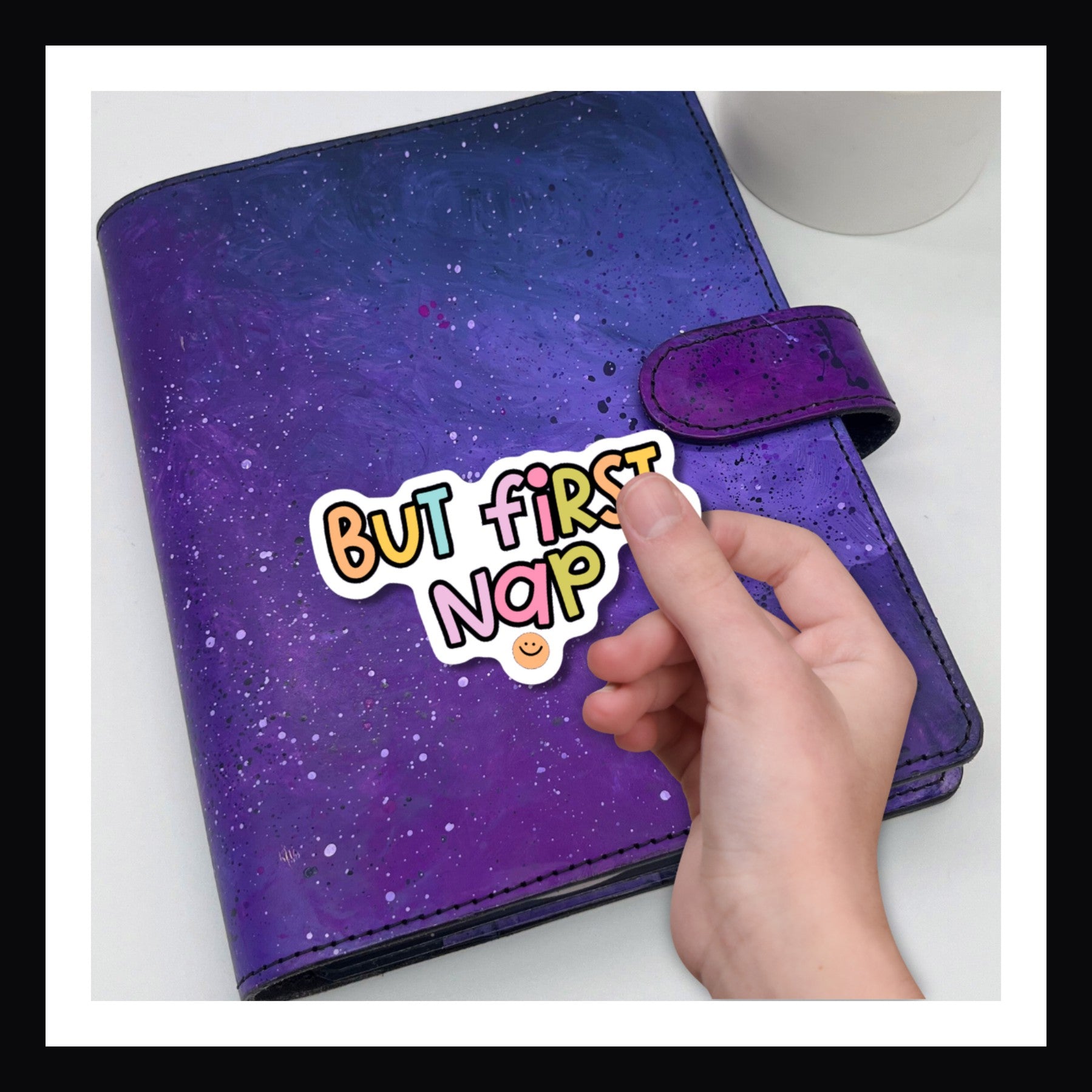 But First, Nap die cut sticker.  Colorful sticker reads "But first, nap" shown on a purple planner.