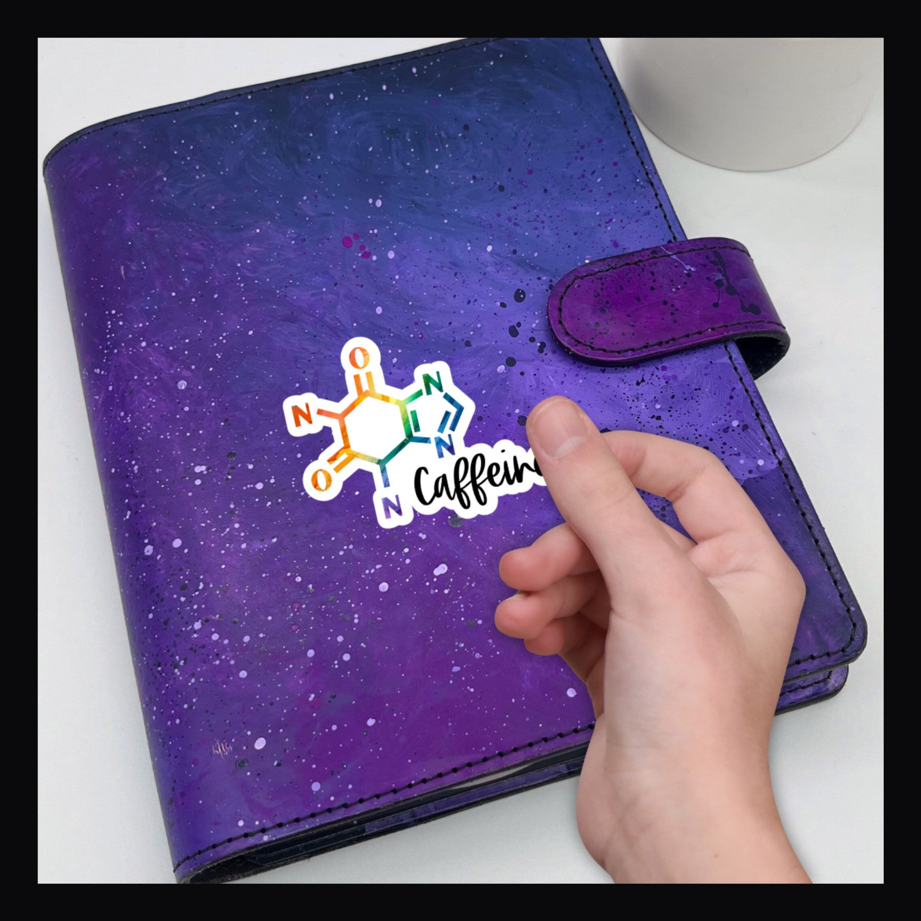 Caffeine Molecule Die Cut shown on a purple planner. 