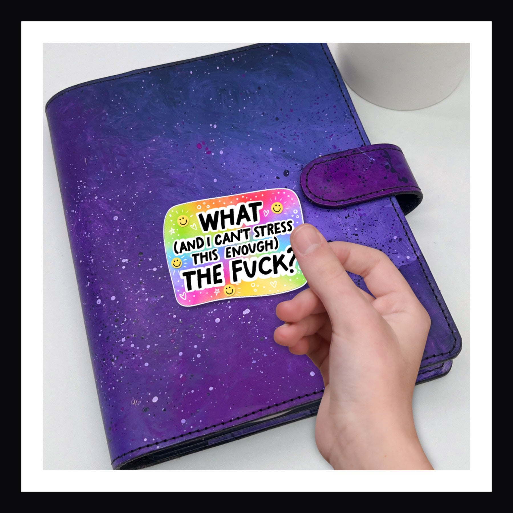 Die Cut Sticker - Can't Stress Enough.  Colorful sticker states "What (and I can't stress this enough) the fuck?" Shown here on a purple planner.