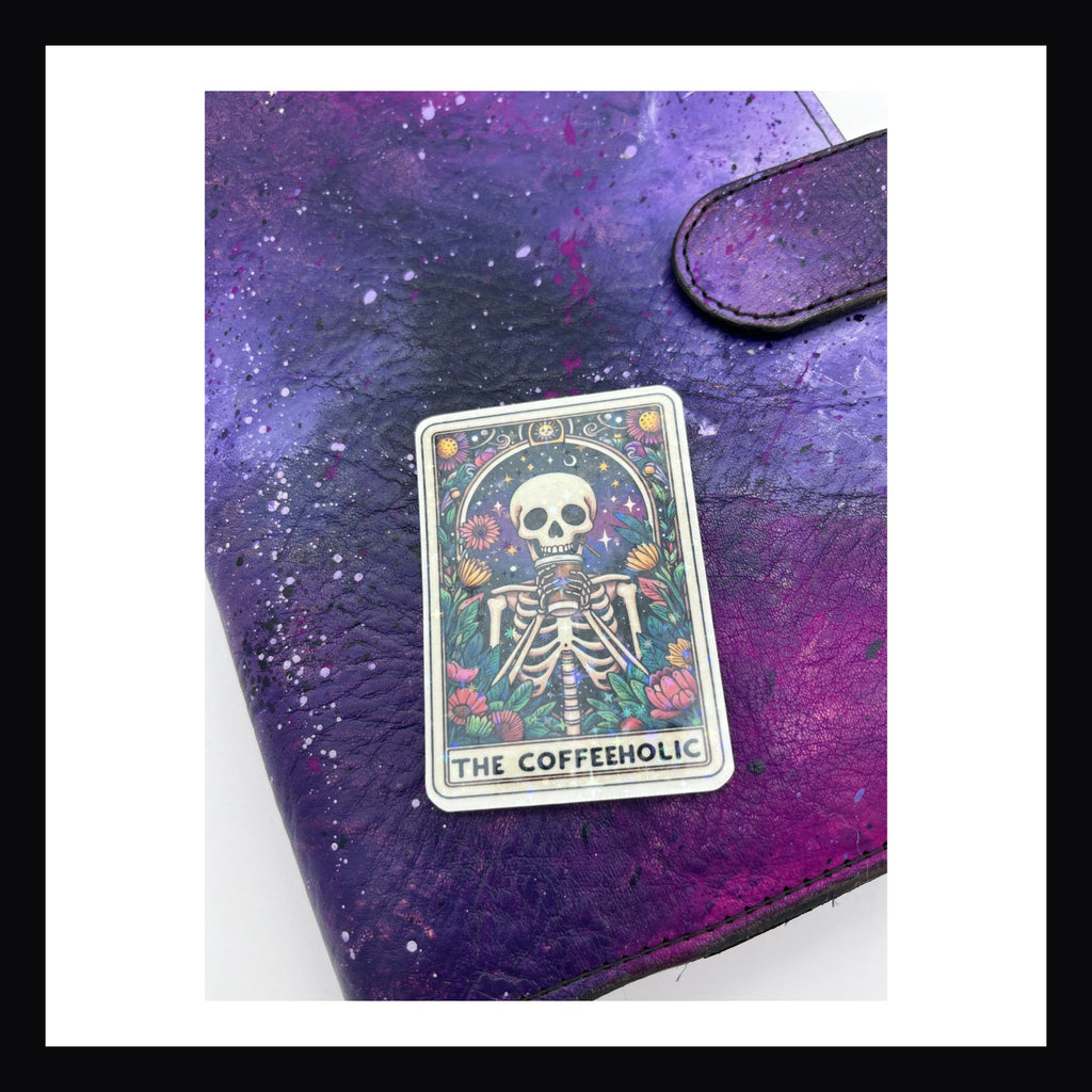 Alternative Tarot Die Cuts - The Coffeeholic is a holographic die cut featuring a skeleton with a coffee cup. 