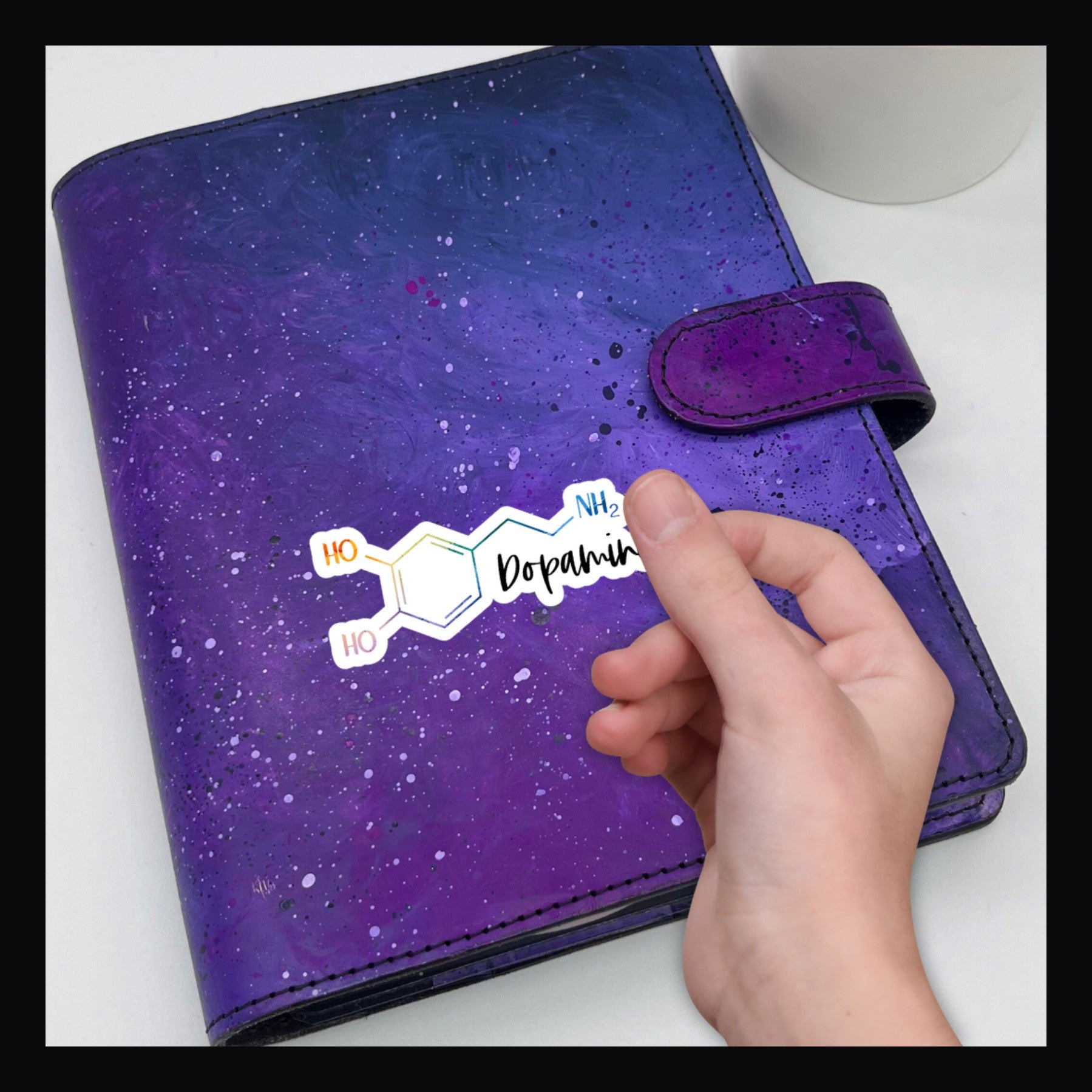 Dopamine Molecule Die Cut shown here on a purple planner.