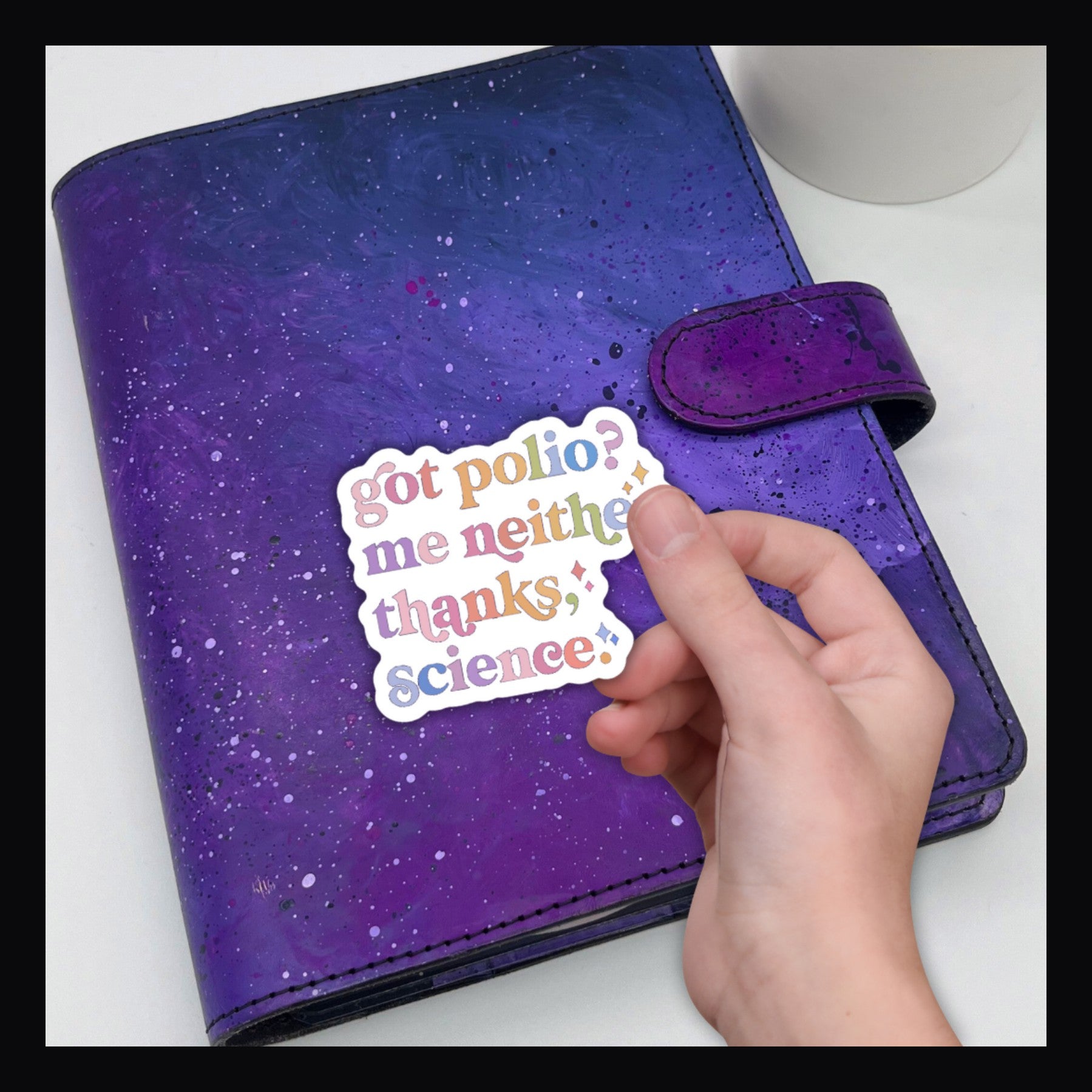 Got Polio? Die Cut says "Got Polio? Me neither thanks, science" shown on a purple planner.