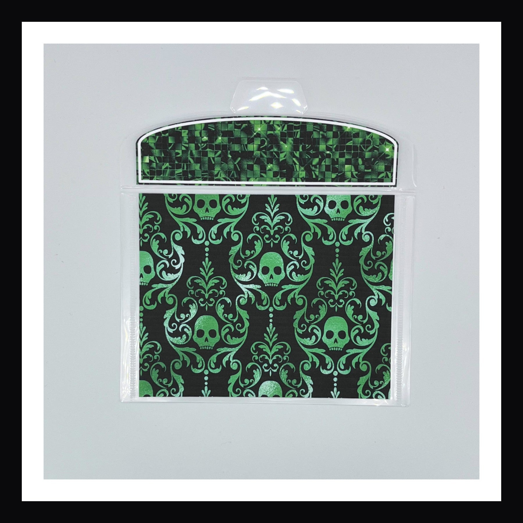 Halloween Glam Envelope shown in green on a white background.