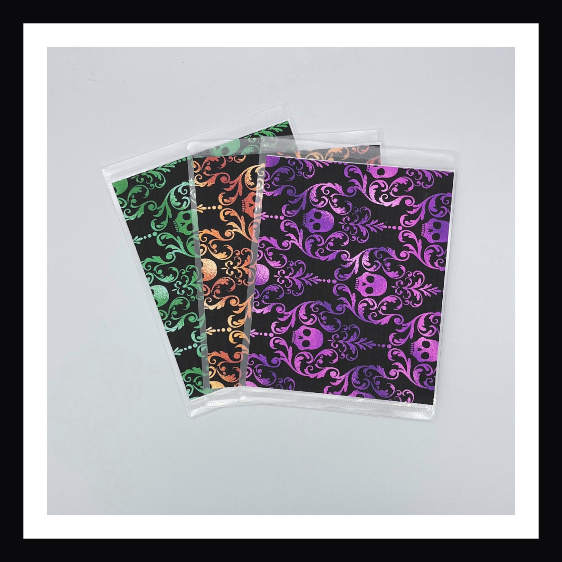 Halloween Glam Envelopes. Set of 3 reusable envelopes with a Halloween damask design. Shown on a white background.