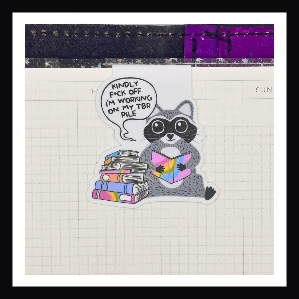 Magnetic Bookmarks - Kindly F*ck Off double sided bookmark shown in use in a planner. 