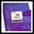 Magnetic Bookmark - Kindly F*ck Off Double sided bookmark shown on top of a purple planner.