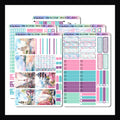 Leaving on a Jetplane Vertical Kit is a 5 page sticker kit sized to best fit popular vertical layout planners.  It features a traveling theme and is done in a bright color palette of pink, blues and purple. 