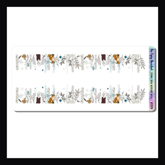 Evening Snow Woodlands Washi Sheet features two strips of dimensional washi stickers.  Each sticker featuring a myriad of woodland animals peeking from trees while snowflakes silently fall.  