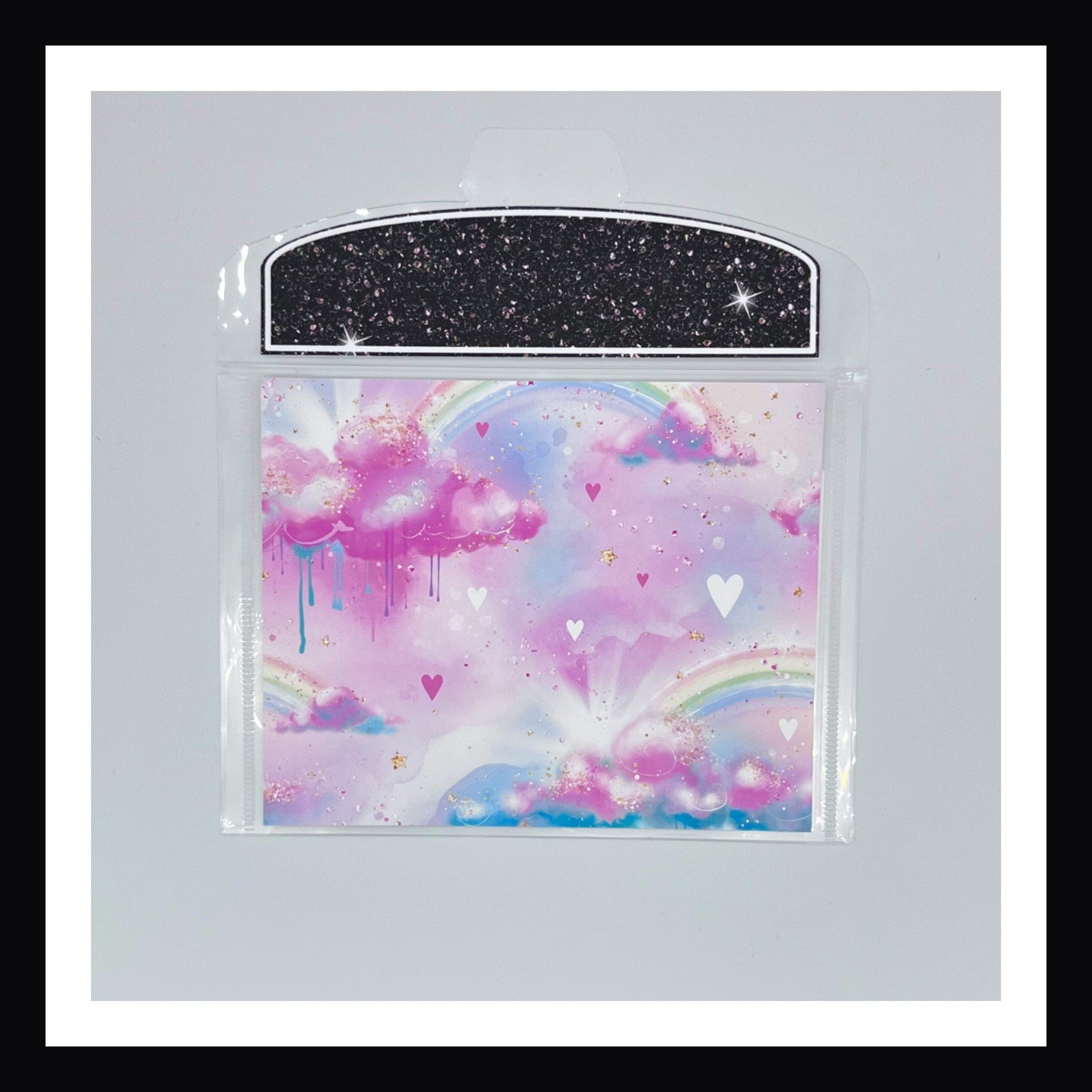 Neon Rainbow Envelope number 3 features a rainbow with clouds and hearts design. Shown on a white background. 