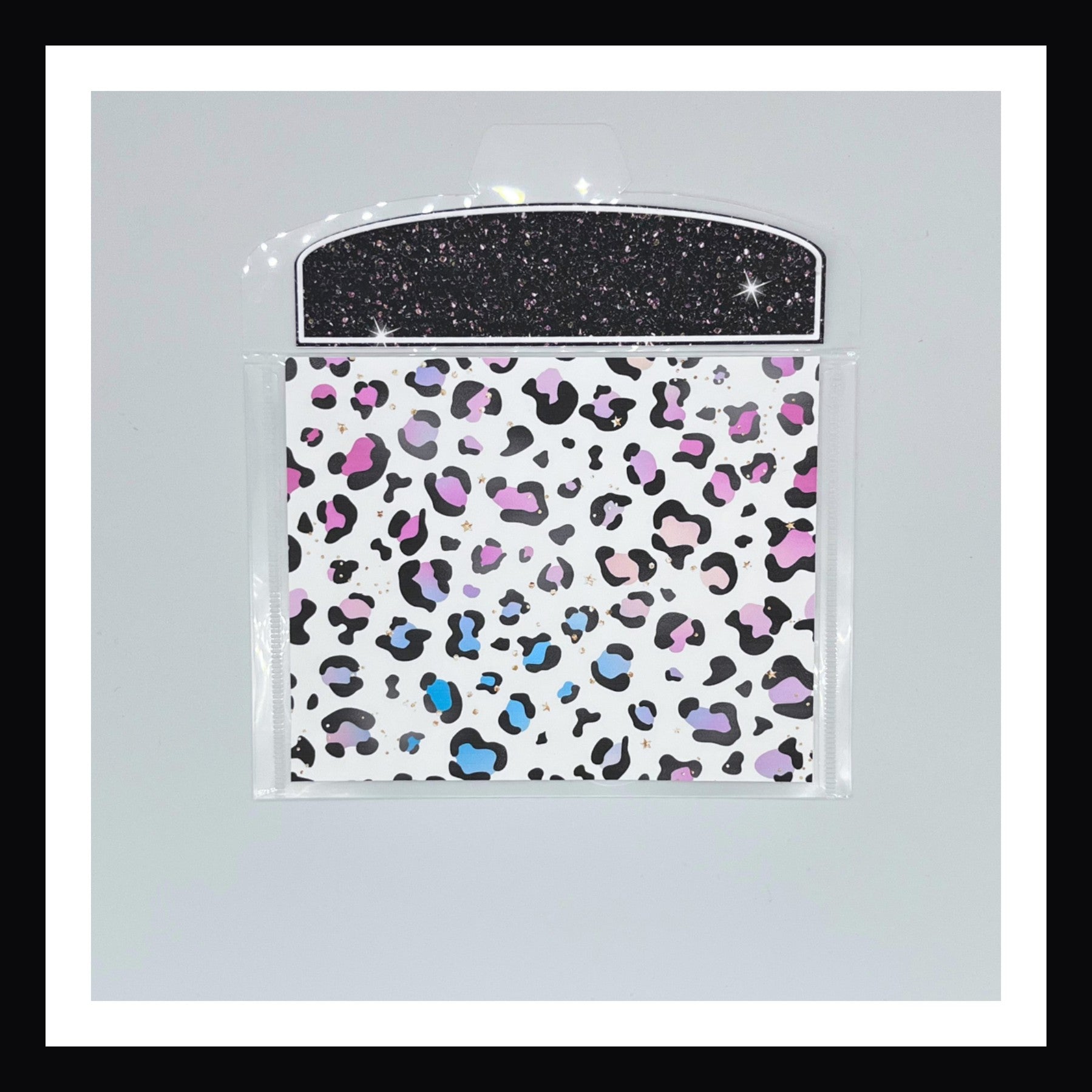 Neon Rainbow Envelope number 1 features a rainbow leopard print. Shown on a white background. 