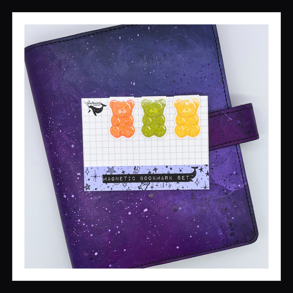 Magnetic Bookmak - Gummy Bear Trio in Orange, Green, & Yellow shown on a purple planner.