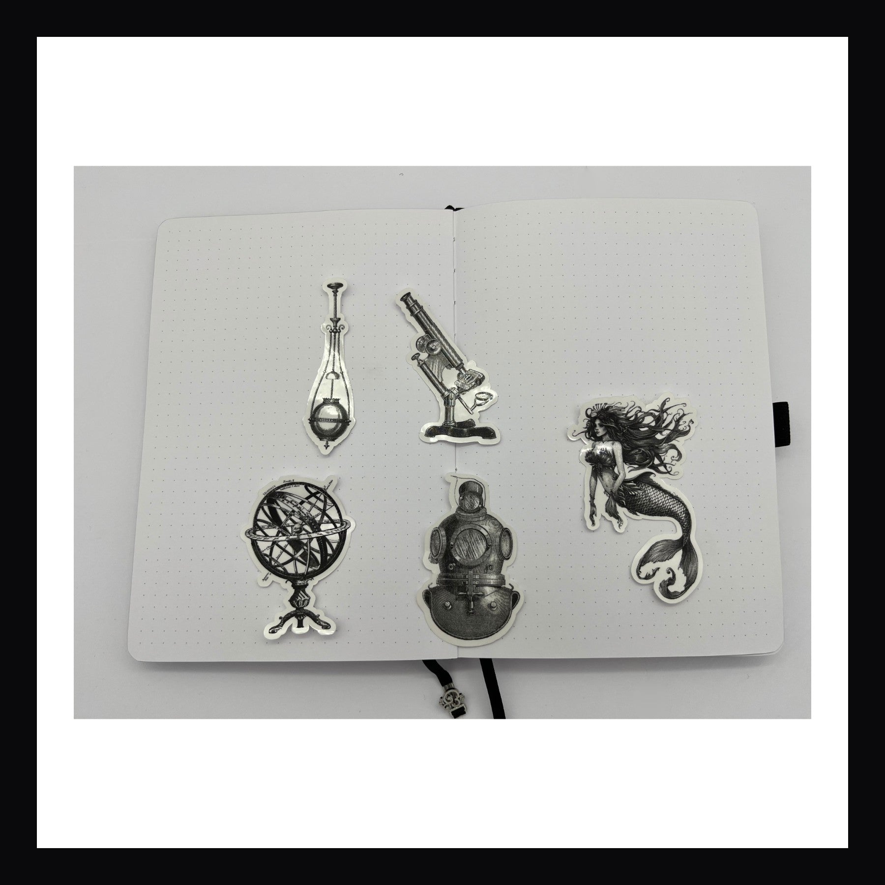 Steampunk Ocean Junk Journaling Kit contains 5 die cut clear stickers.  Each featuring a thematic image printed in black on a transparent background. 