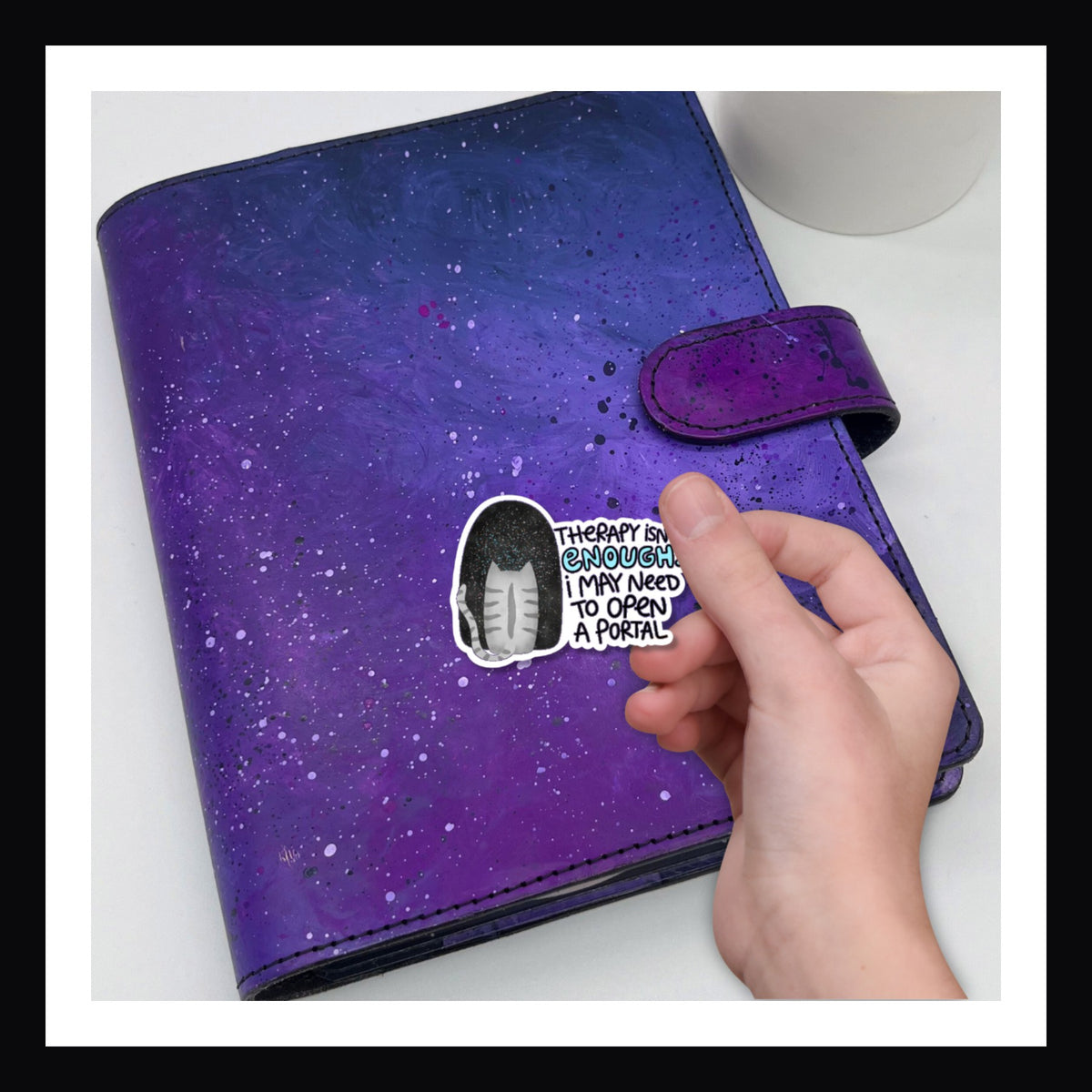 Open A Portal Die Cut Sticker features an image of a cat standing in front of a portal to the void.  It reads "Therapy isn't enough I may need to open a portal"