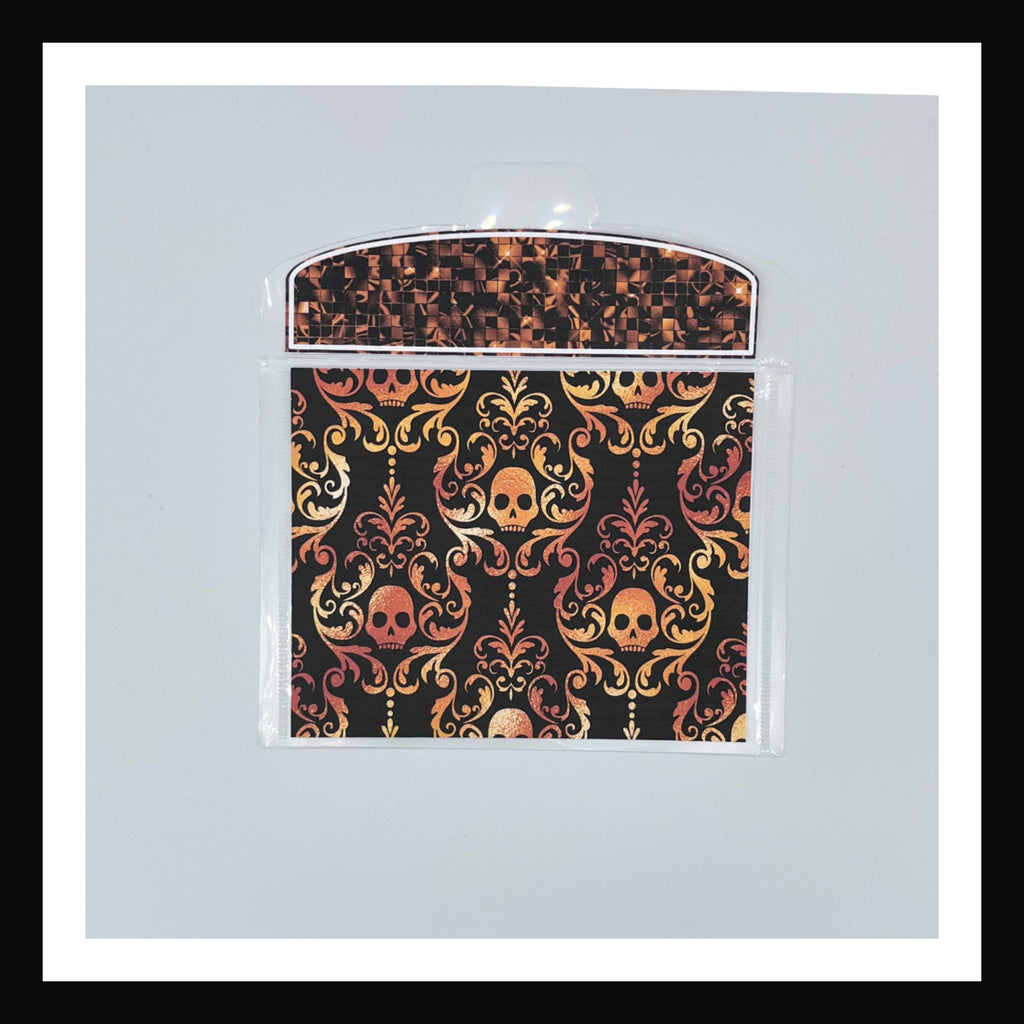 Halloween Glam Envelope shown in orange on a white background.