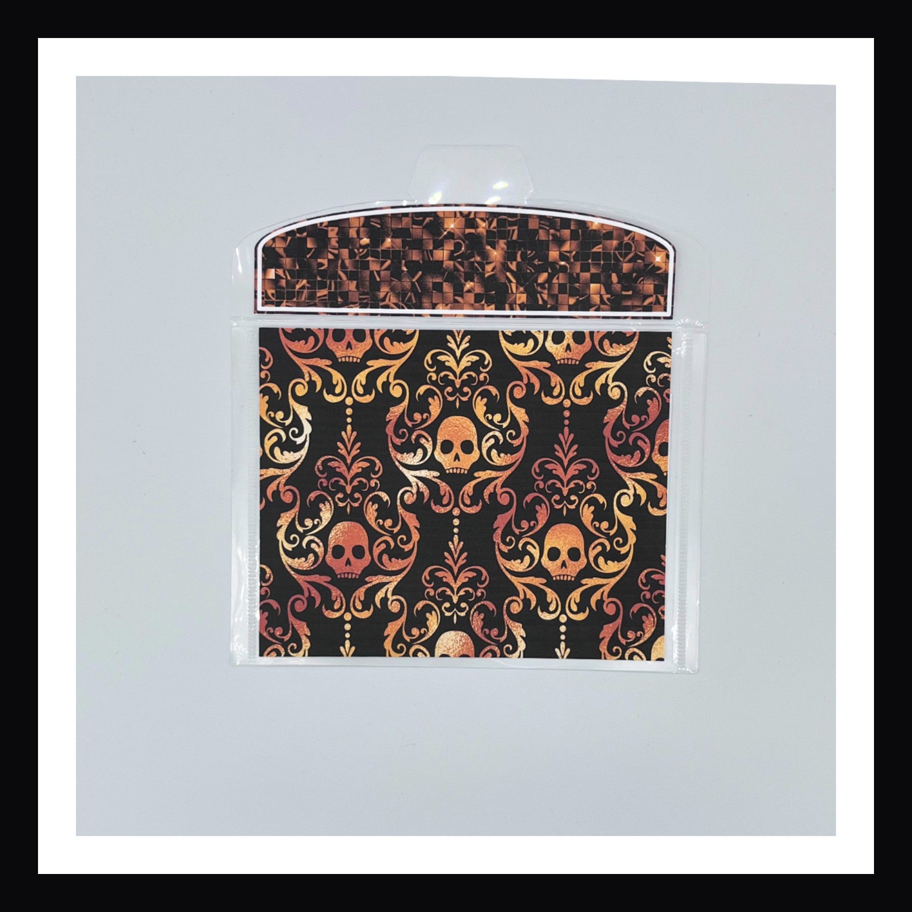 Halloween Glam Envelope shown in orange on a white background.