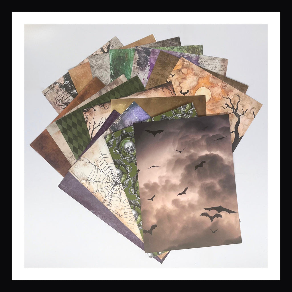 Deluxe Halloween Junk Journal Kit features 16 6x8" yardstick papers.  Each paper is double sided, color palette focuses on oranges, purples, greens, greys and browns. 