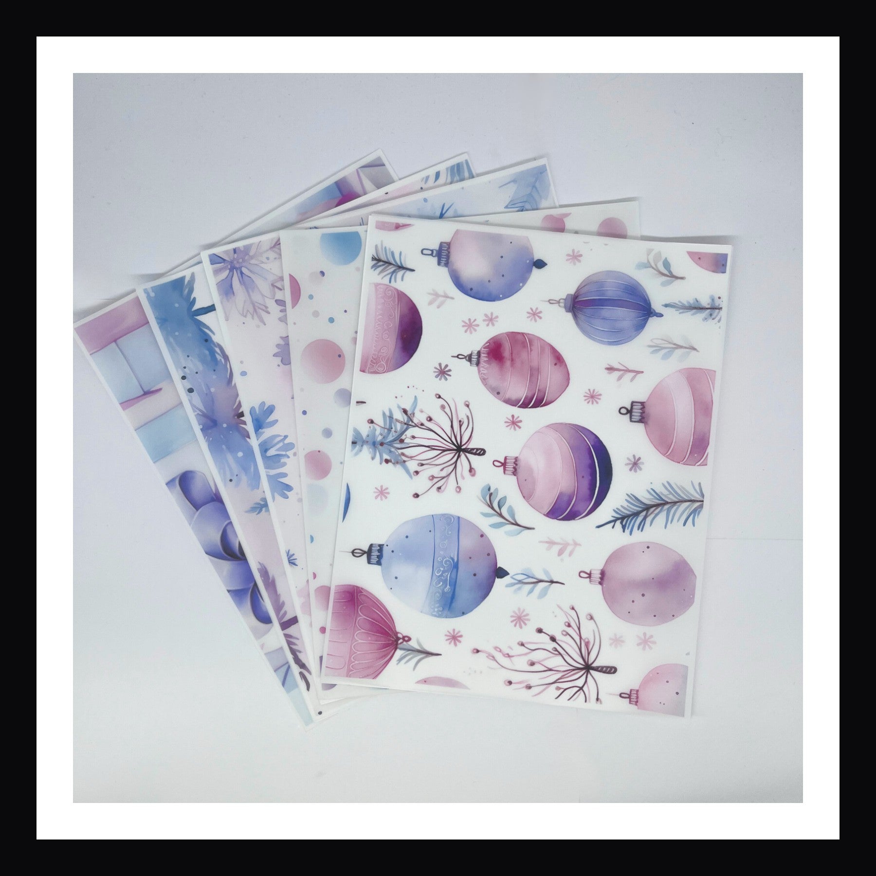 Pastel Watercolor Christmas Vellum is a collection of 5 sheets of 8x10 vellum.  Each sheet features a unique Christmas inspired design in a dreamy pastel watercolor style. 