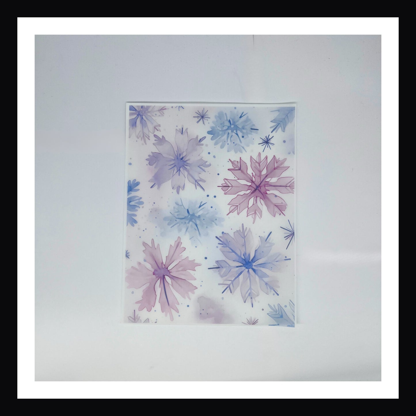 Pastel Watercolor Christmas Vellum - Pastel Watercolor Snowflakes is a 8x10 sheet of printed vellum.  This design features a variety of watercolor snowflakes.  The print features a pastel color palette. 