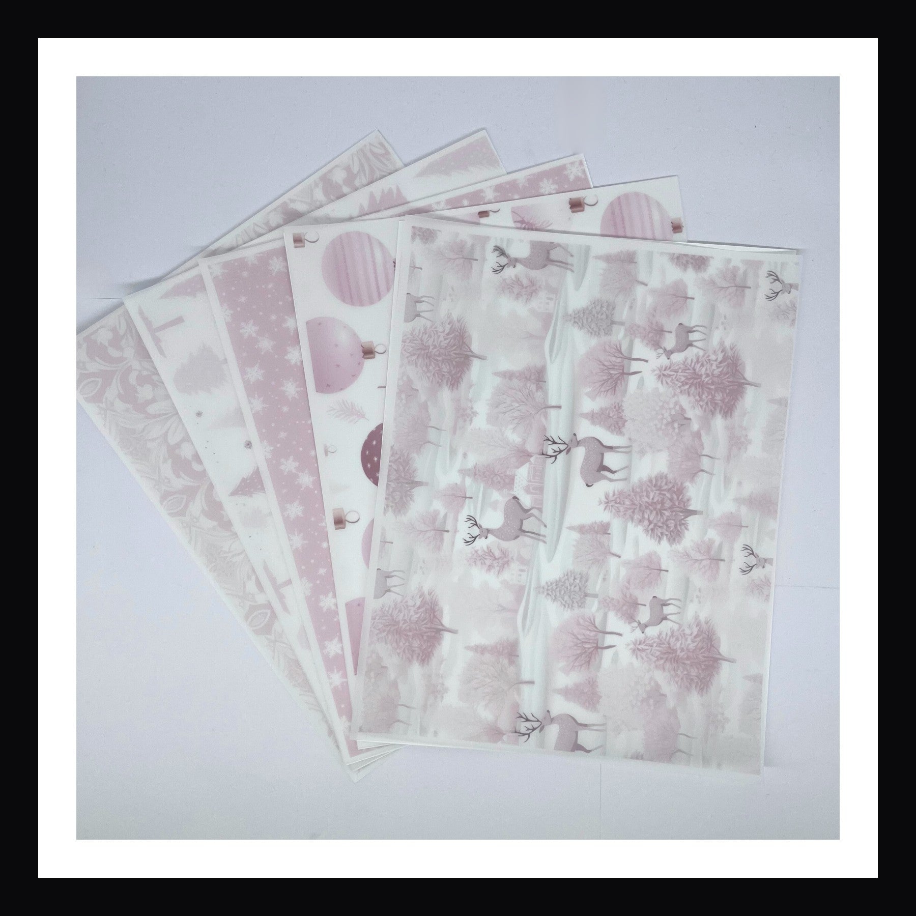Pink Christmas Vellum is a collection of 5 sheets of 8x10 printed vellum.  Each sheet features a unique Christmas print in a delicate light pink.