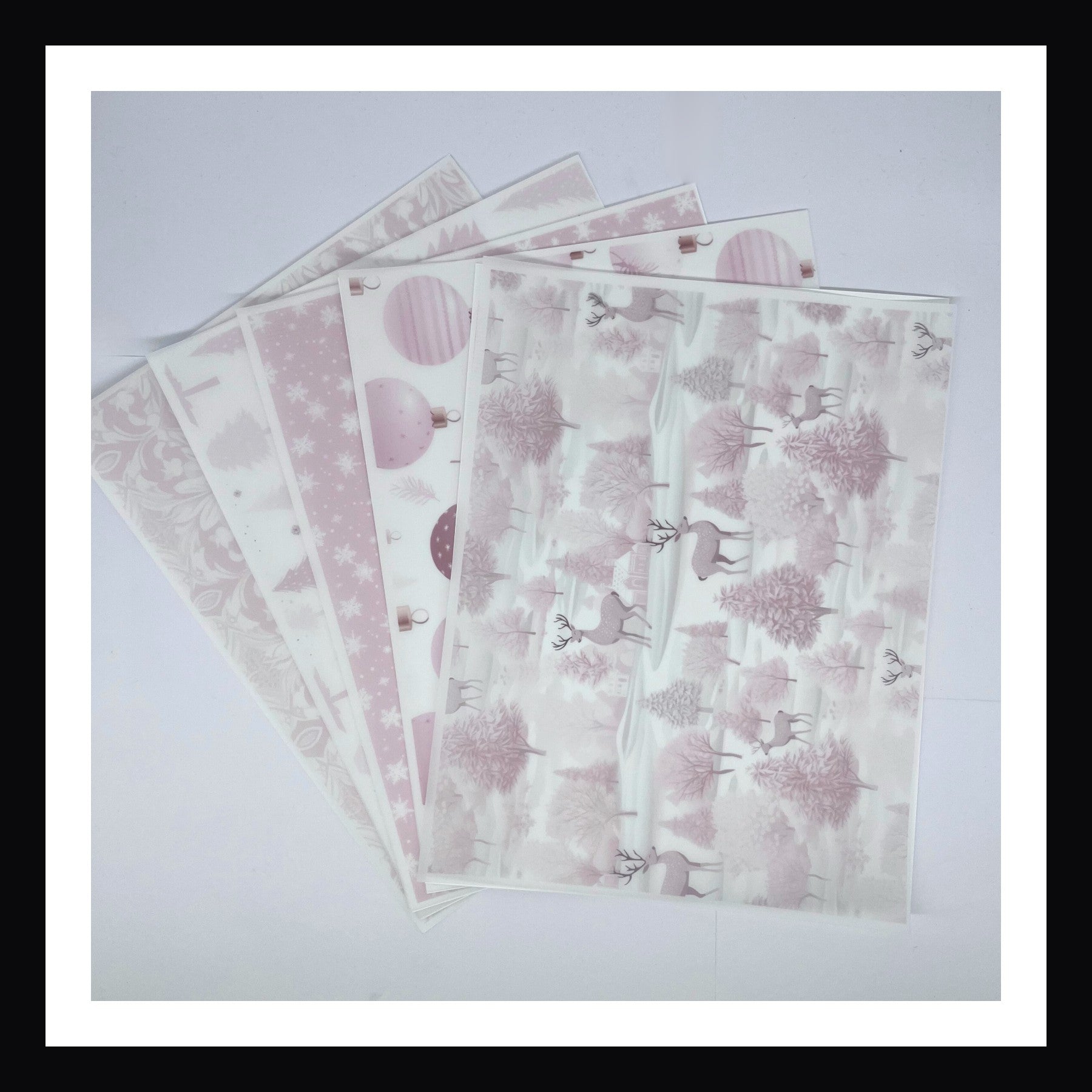 Pink Christmas Vellum is a collection of 5 sheets of 8x10 printed vellum.  Each sheet features a unique Christmas print in a delicate light pink. 