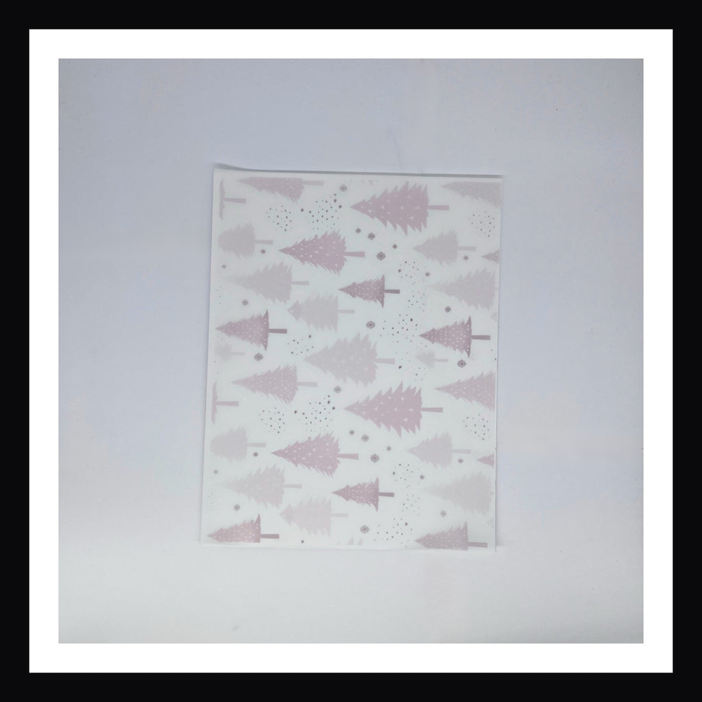 Pink Christmas Vellum - Pink Trees.  A 8x10 sheet of printed vellum featuring a collection of pink Christmas trees and a scattering of stylized snowflakes. 