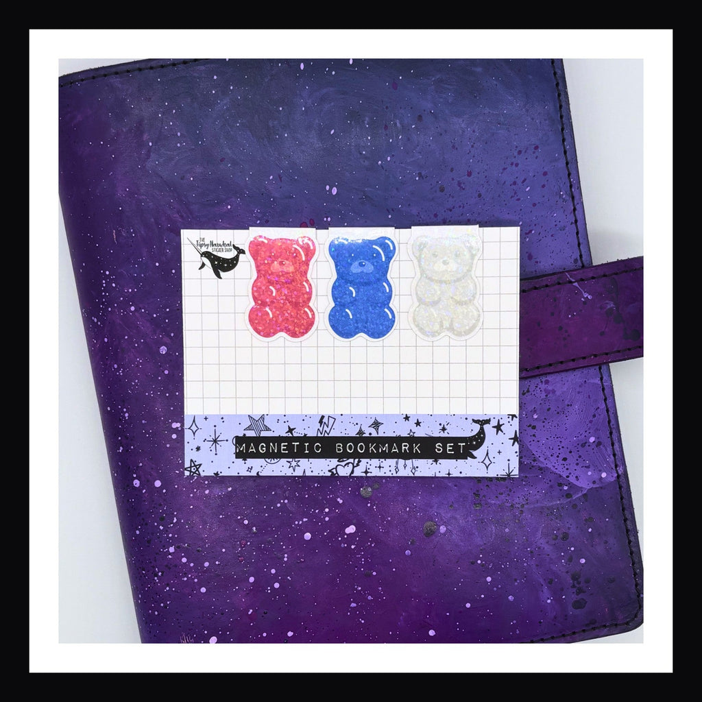 Magnetic Bookmark - Gummy Bear Trio in red, blue & white shown on a purple planner.