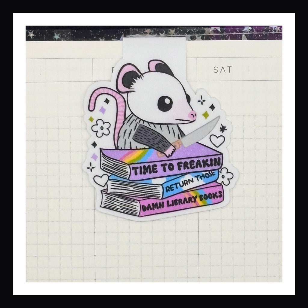 Magnetic Bookmark - Return Your Library Books shown in use inside a planner.