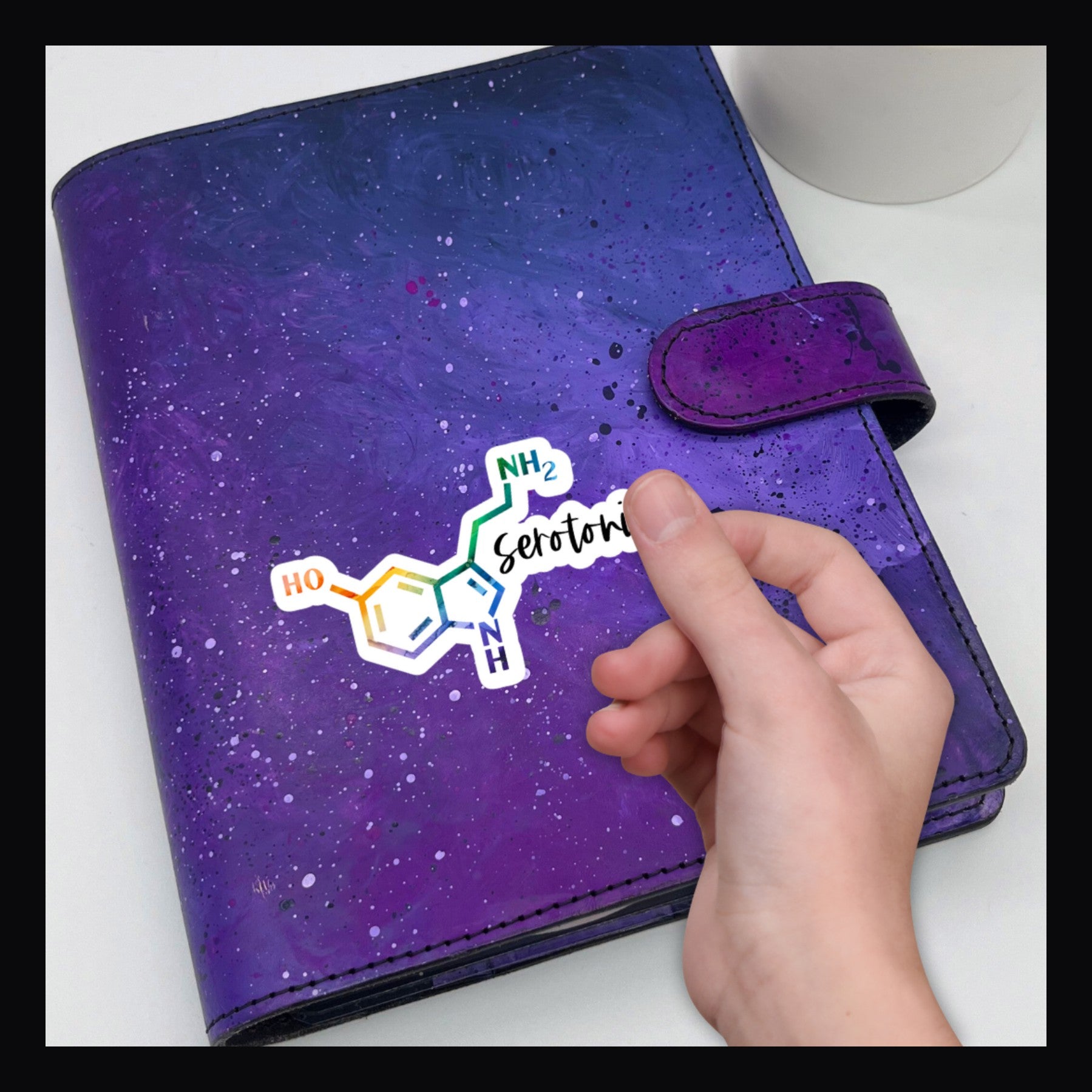 Serotonin Molecule Die Cut shown on a purple planer.