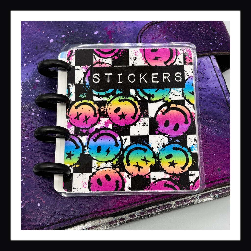 Freestyle Mini Discbound Cover - Rainbow  smiley face cover shown on a purple planner.